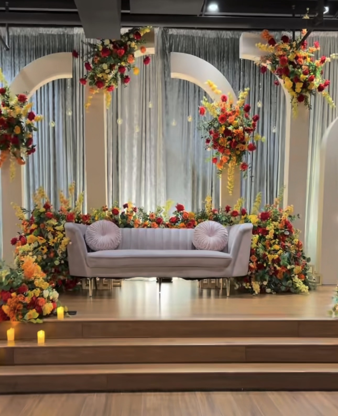 Floral photo backdrop and lounge seating