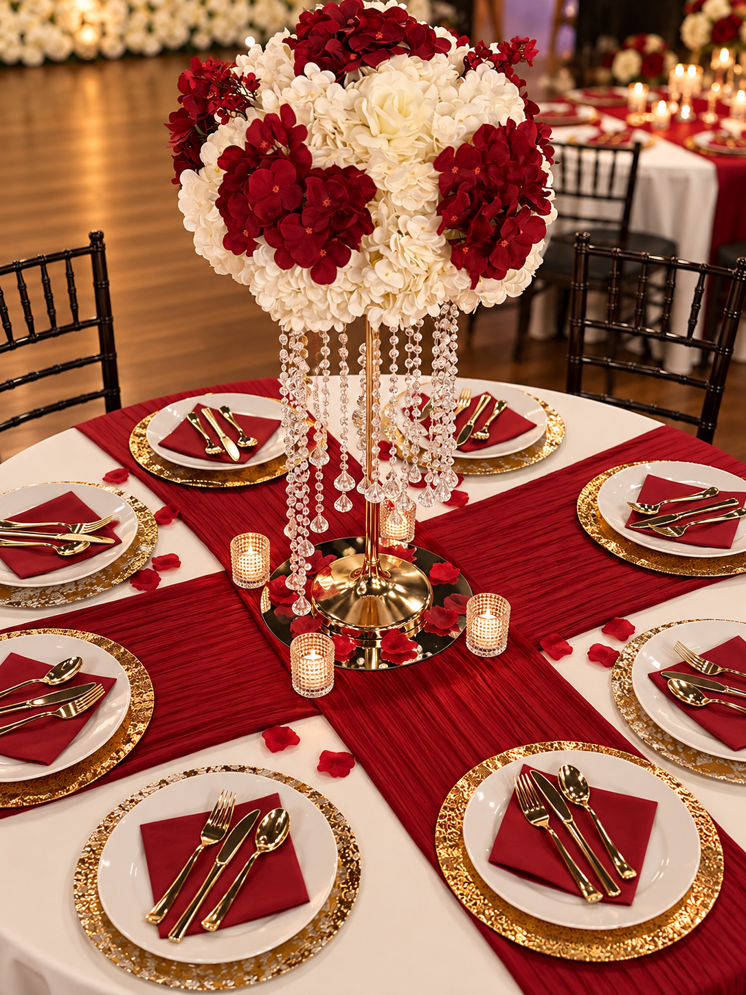 Red and gold tablescape with a floral centerpiece