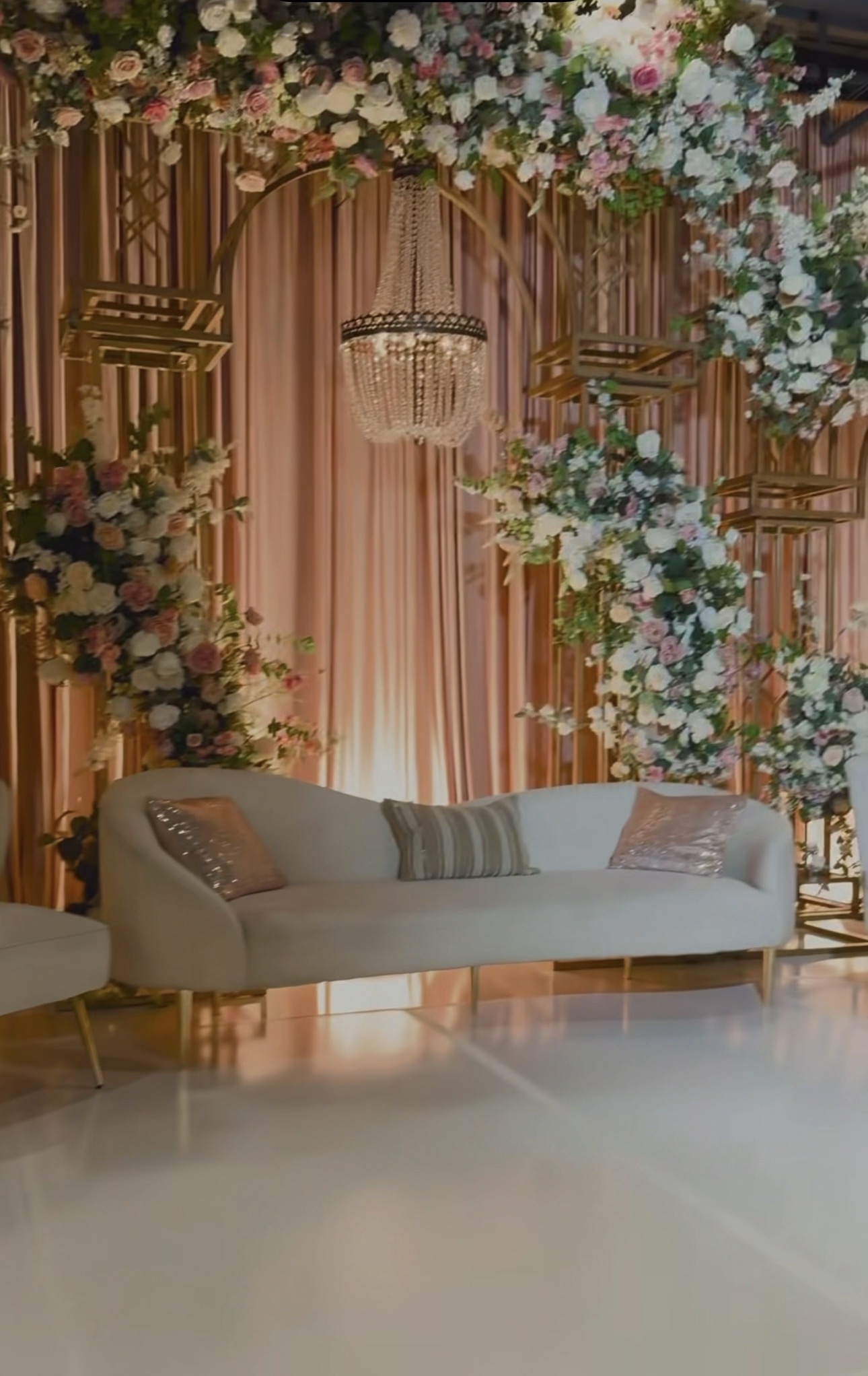 Blush floral backdrop and elegant lounge