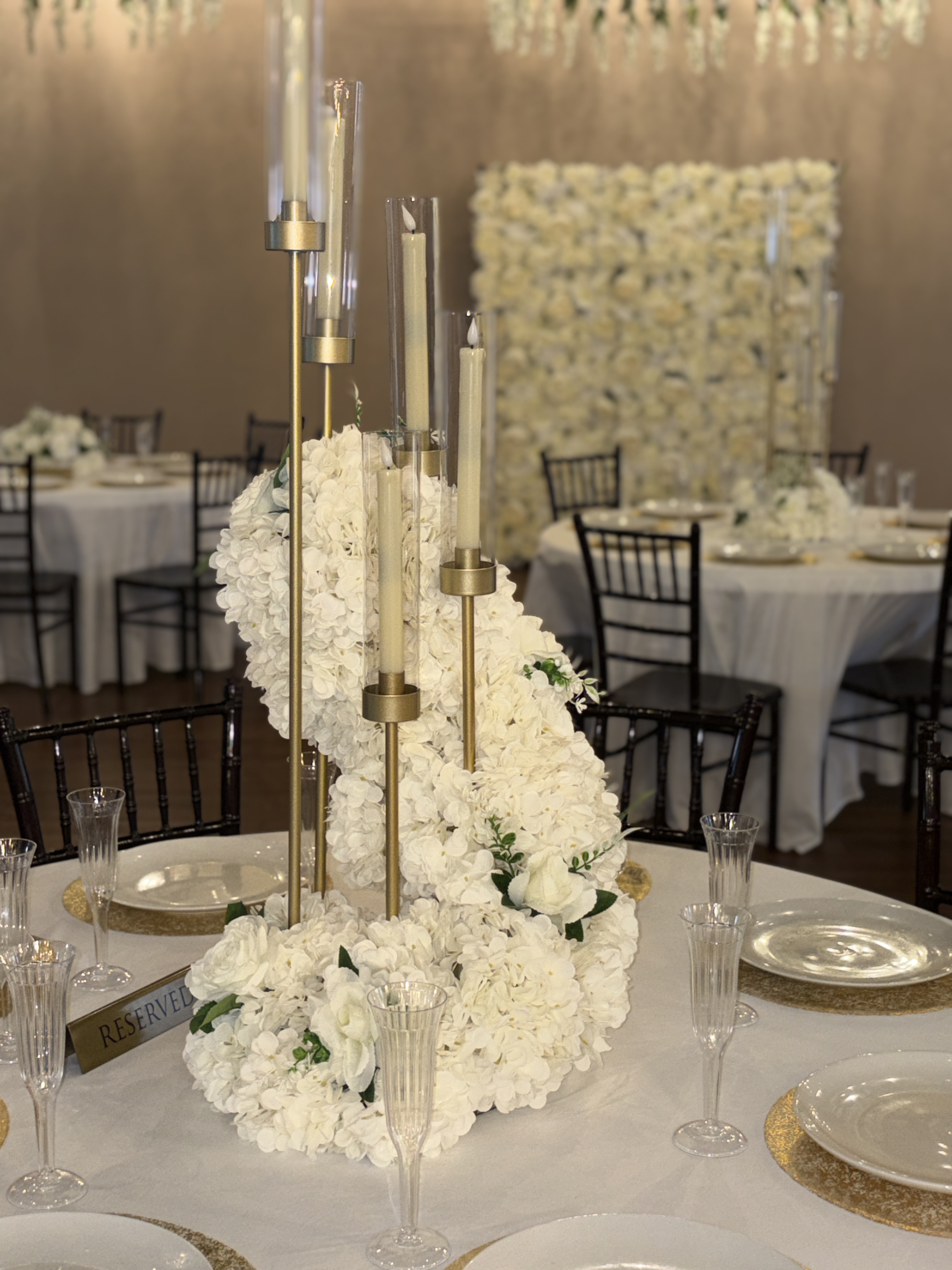 Candlelit table setting with white florals